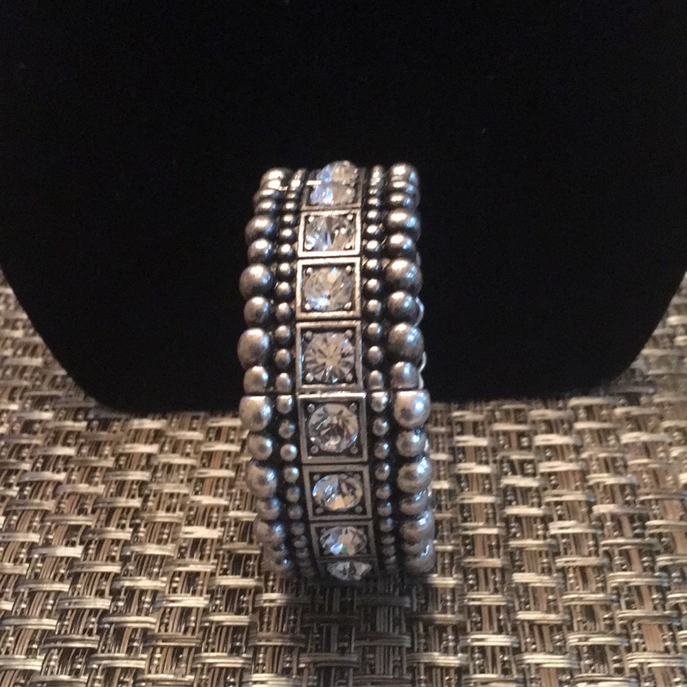 Silver bracelet with clear stone.